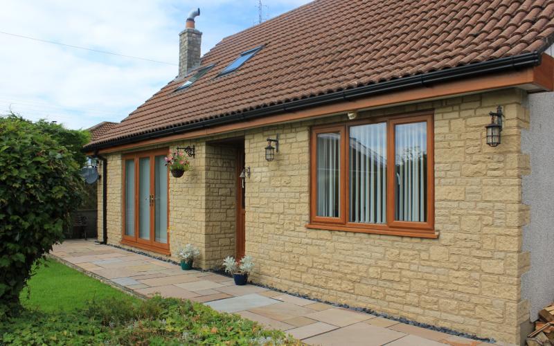 A bungalow with sandy coloured bricks 